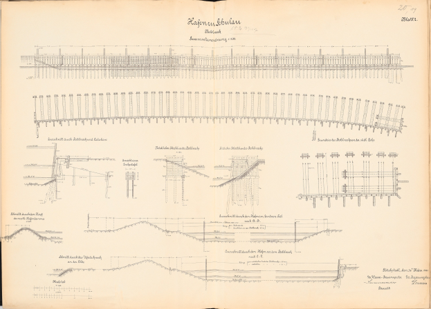 Offenes Buch mit detaillierten Zeichnungen und Texten, die ein Schienensystem einschließlich einer Eisenbahnschienen-Illustration zeigen.