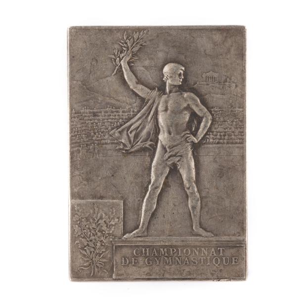 Silberne Plakette mit einer Statue eines triumphierenden Mannes mit einem Lorbeerkranz, beschriftet mit "Championnat de Gymnastique."