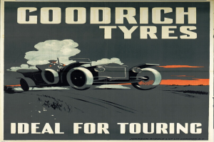 Ein Plakat, das Goodrich Reifen bewirbt und ein Auto mit einer Person zeigt, sowie Text, der Informationen über das Unternehmen und seine Dienstleistungen enthält.