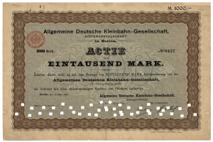 Ein altes deutsches Wertpapier, das von der deutschen Regierung ausgegeben wurde und Text sowie einen Stempel enthält.