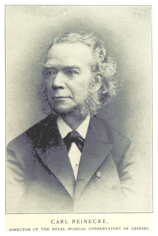 Schwarz-weiß-Porträt von Carl Reinecke, Direktor des Königlichen Musikalischen Konservatoriums Leipzig, in einem Anzug, mit Text unten.