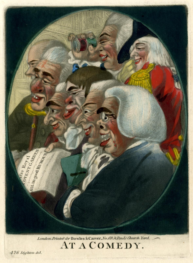 Gruppe von Menschen, die in einem Kreis bei einer Comedy-Veranstaltung lachen, einer hält ein Blatt Papier.